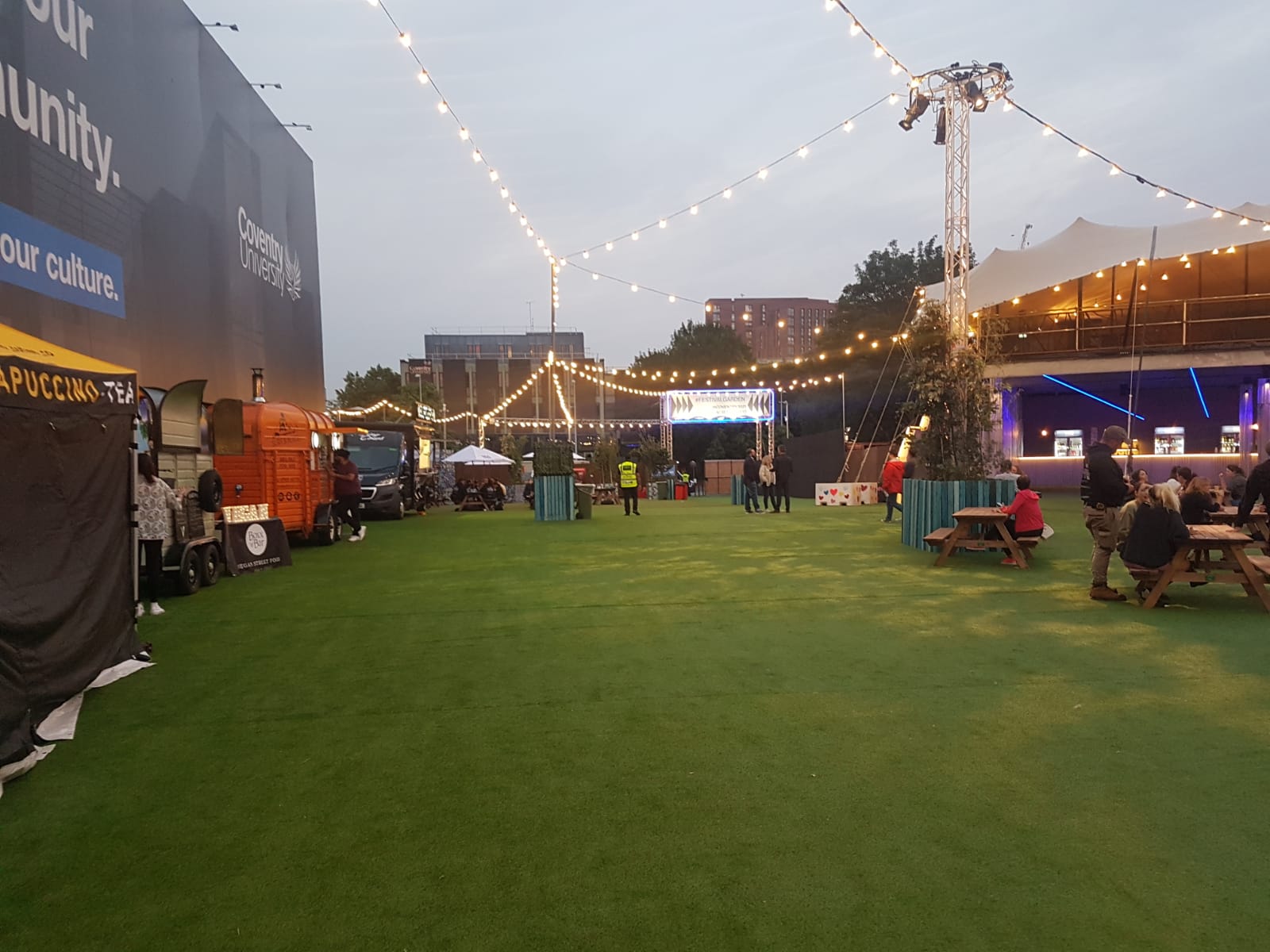 Mobile CCTV towers and event infrastructure positioned around the event site