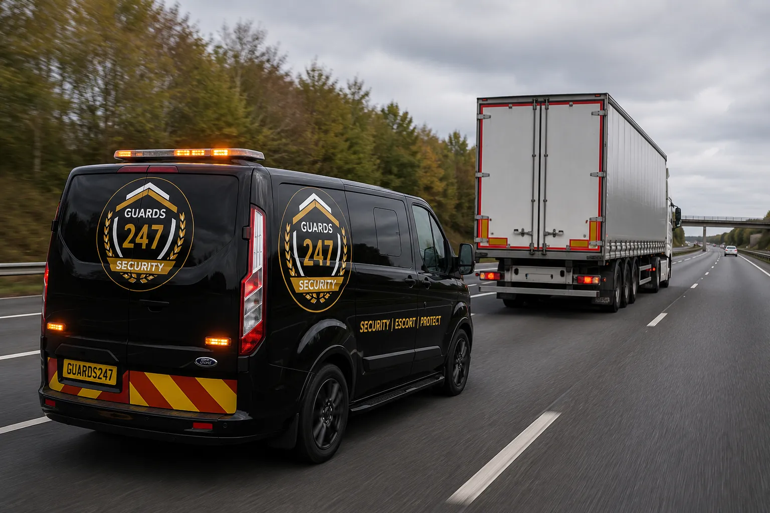 Guards 247 branded vehicle escorting an HGV